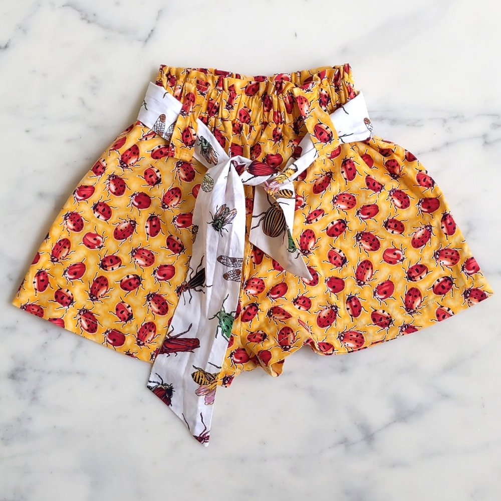 NWOT. 100% Cotton Ladybug Shorts with colorful insects fabric belt.